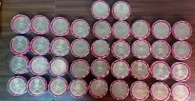 Capsuled brass coins for an Indian Army unit