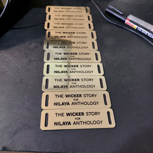 Batch of Nilaya Anthology brass labels
