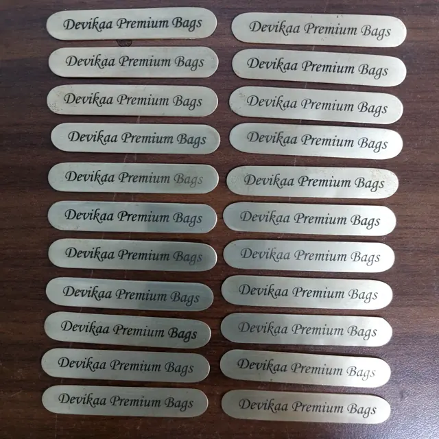 Brass script labels for Devikaa Premium Bags