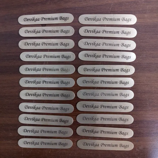 Devikaa Premium Bags brass labels laid out