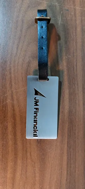 JM Financial steel luggage tag on a blue strap
