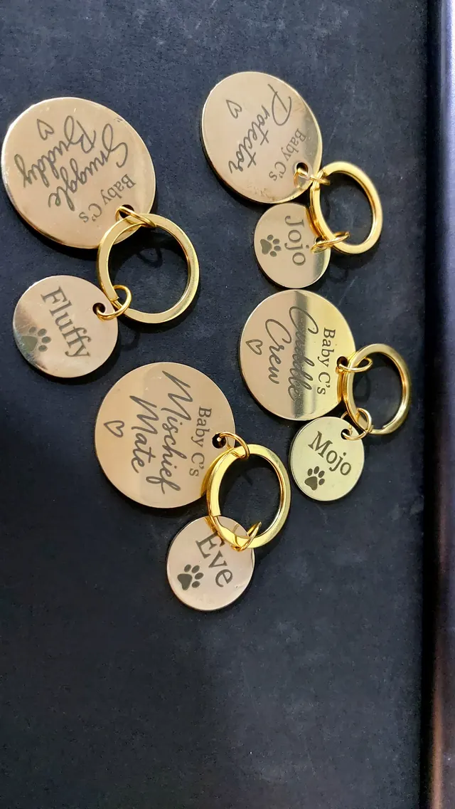 Batch of engraved round brass tags