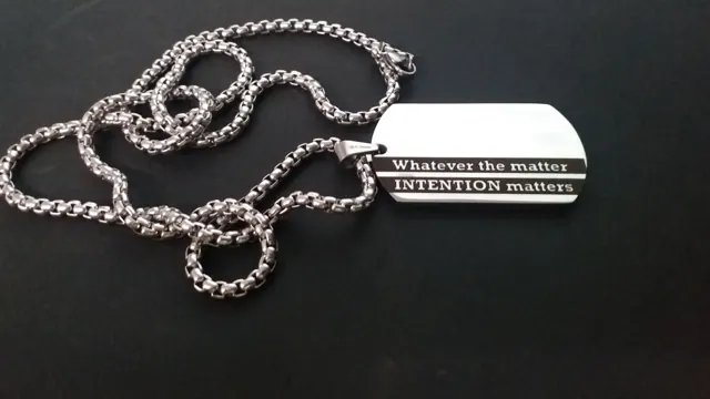 Dog tag engraved Whatever the matter, intention matters on a black band