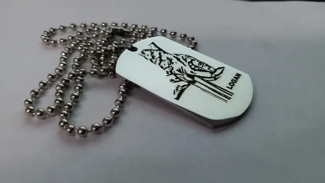 White dog tag with a black wolf artwork and the name Logan