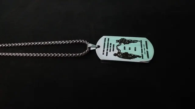 Dog tag with soldier silhouettes and a quote