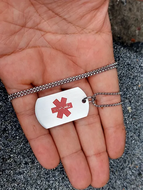 Medical alert dog tag with a red colour-filled star of life