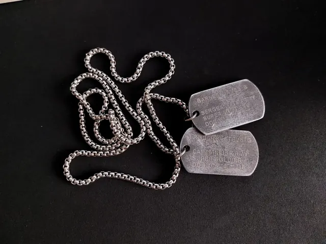 Antique dog tag pair on a box chain