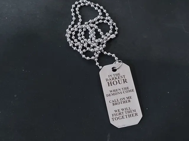 Dog tag engraved In the darkest hour, call on me brother