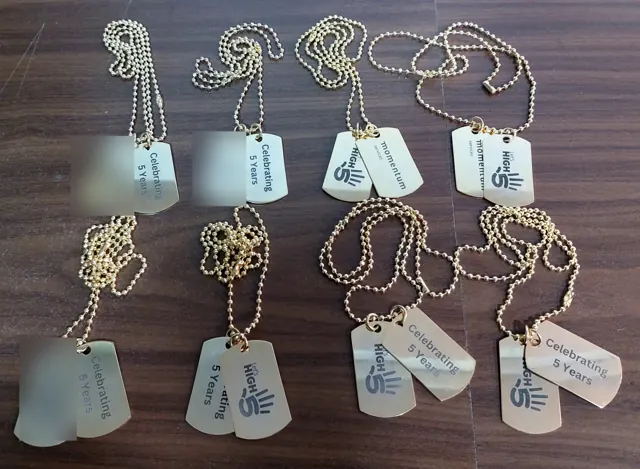Gold-tone company milestone dog tags
