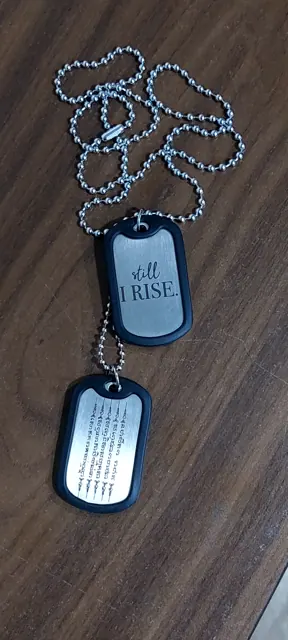 Dog tags in black silencers engraved Still I Rise