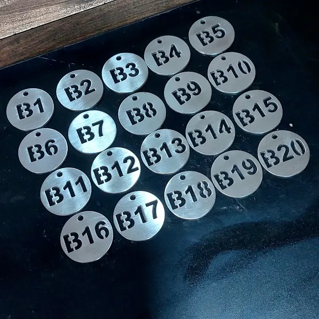 Stainless steel tags with cut-through numbers B1 to B20