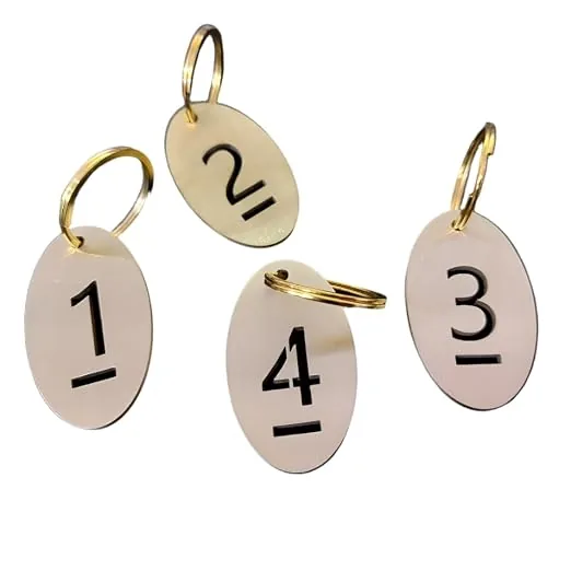 Four oval brass key tags numbered 1 to 4 on brass split rings