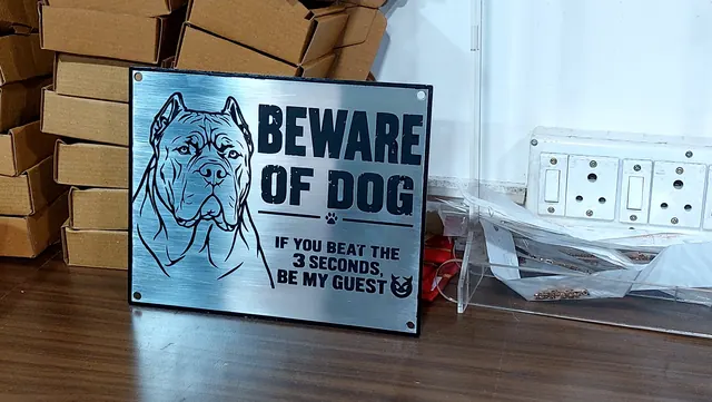 Stainless steel Beware of Dog sign with engraved dog portrait